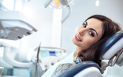 A woman sitting in a dental chair