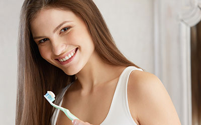 Young woman with toothbrush