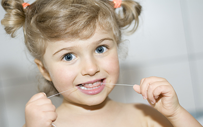 Child Flossing
