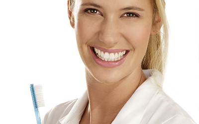 Woman smiling with toothbrush