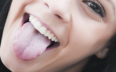 Young woman with tongue sticking out