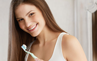 Young woman with toothbrush