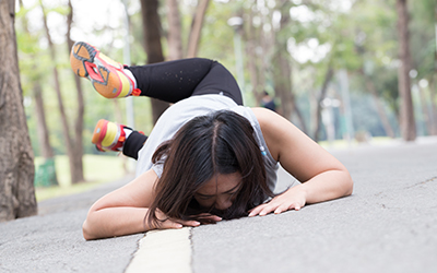 Woman falling on her face